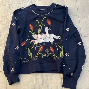 Women’s medium needed an embroidered swan sweater..
